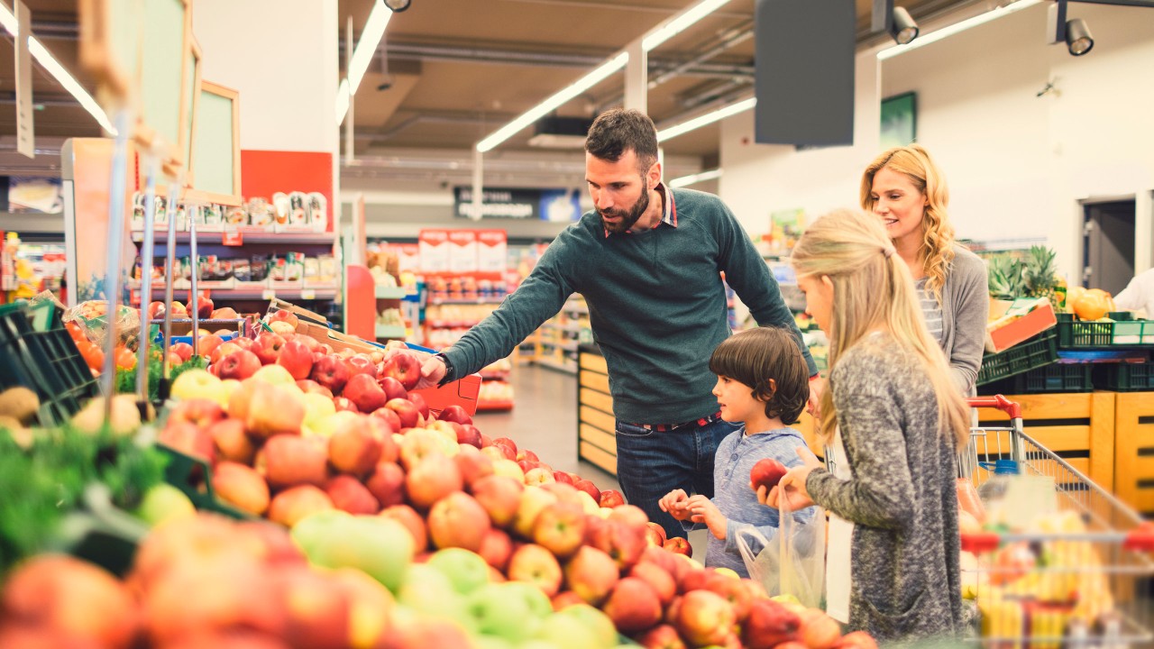 Family shopping at the grocery store; image used for HSBC Sri Lanka Daily Essentials page
