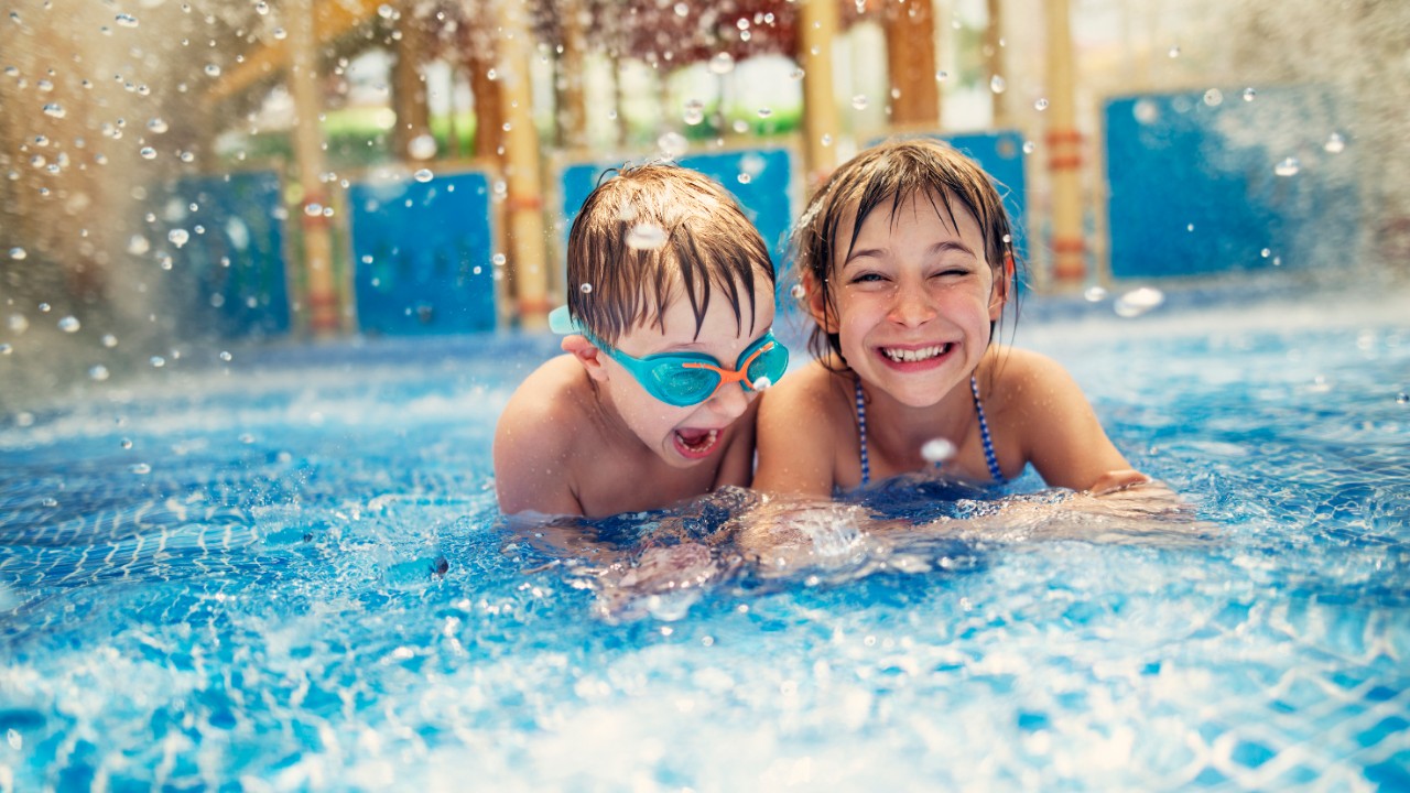a little girl and a boy playing at water park; image used for HSBC Sri Lanka credit card local holiday offer page.
