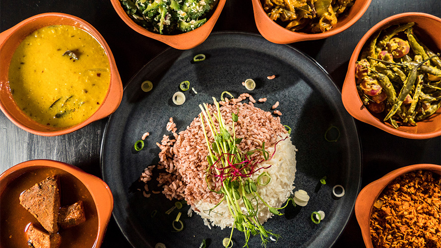 A female chief dressing up a delicate dish; image used for HSBC Sri Lanka credit card wine and dine offer page